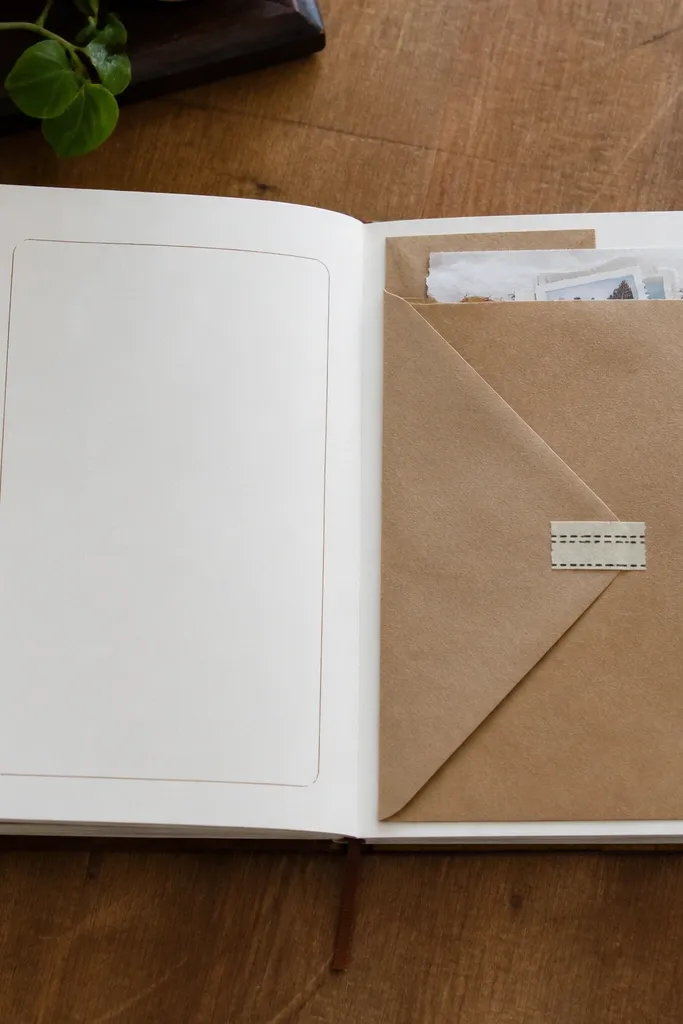 Journal page with a folded envelope shape holding small paper scraps and a short note section