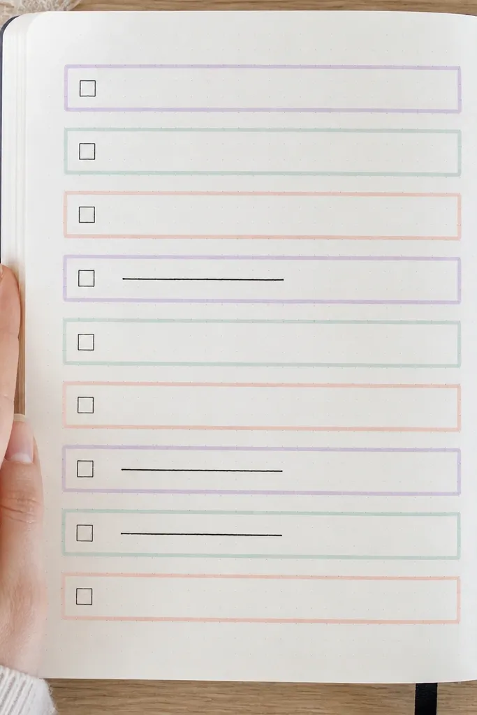 Journal page with pastel washi checklist boxes and boxed lines for writing