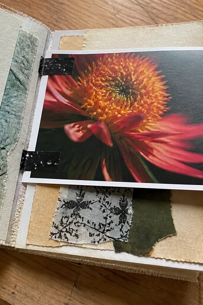 A flip panel page with a magazine cutout and black washi tape hinges