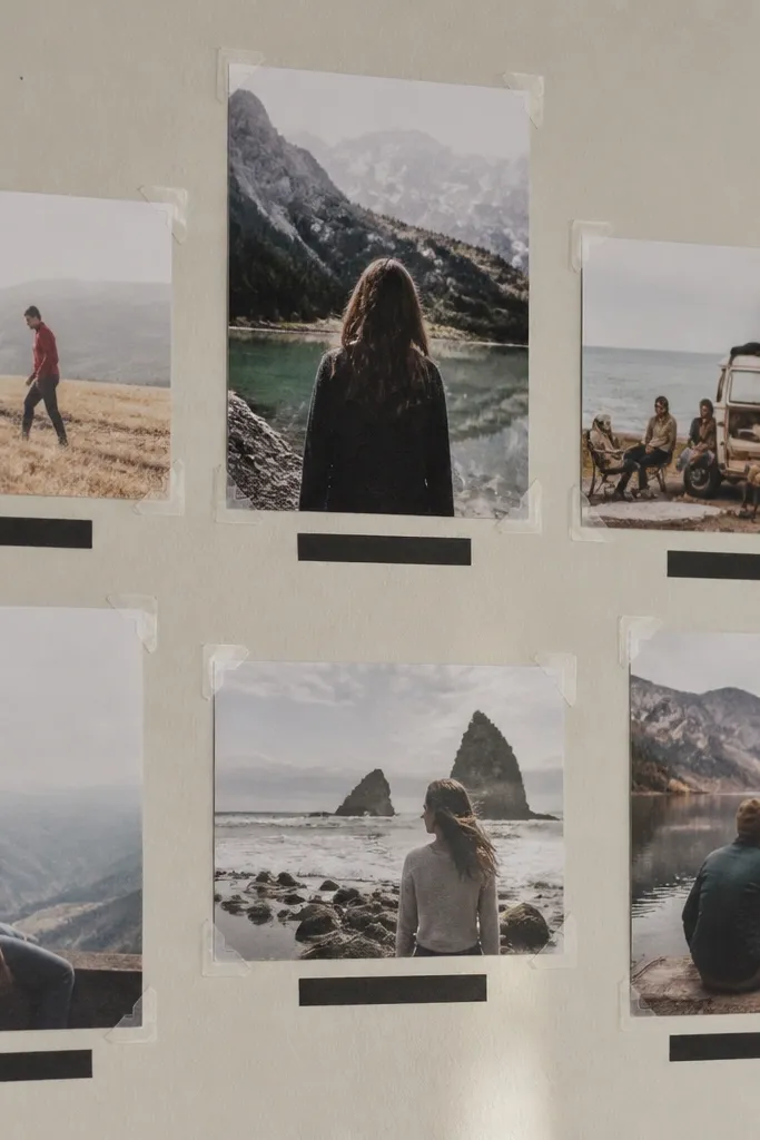 Vision board with photos held by paper corners and minimal black label strips