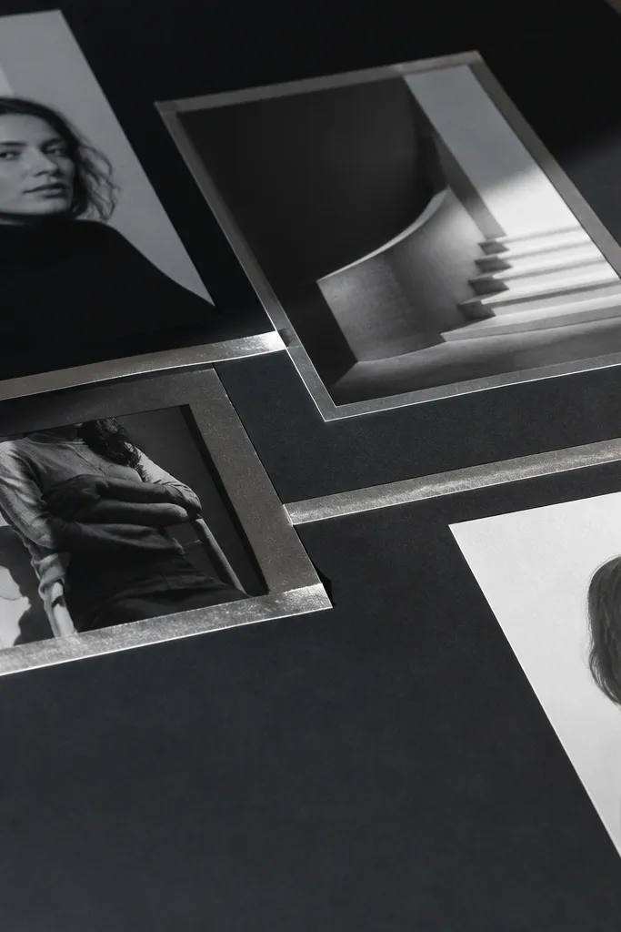 Monochrome vision board with thin gold foil tape lines and black labels