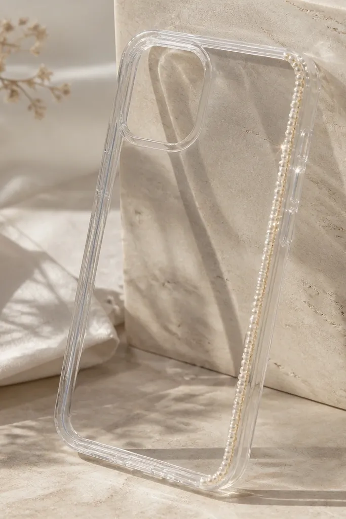 A clear TPU phone case with a delicate border line made of tiny seed beads along one edge. The beads catch light and create small sparkles. The rest of the case is transparent and smooth.