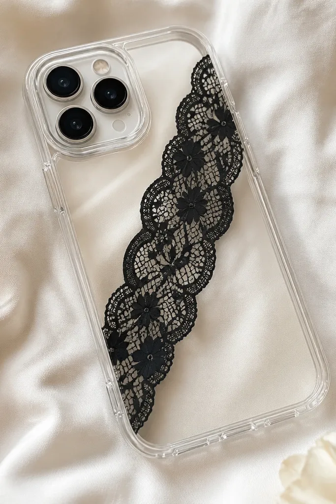A clear phone case with a diagonal strip of black lace across the back, with the lace edges sealed so they look smooth.