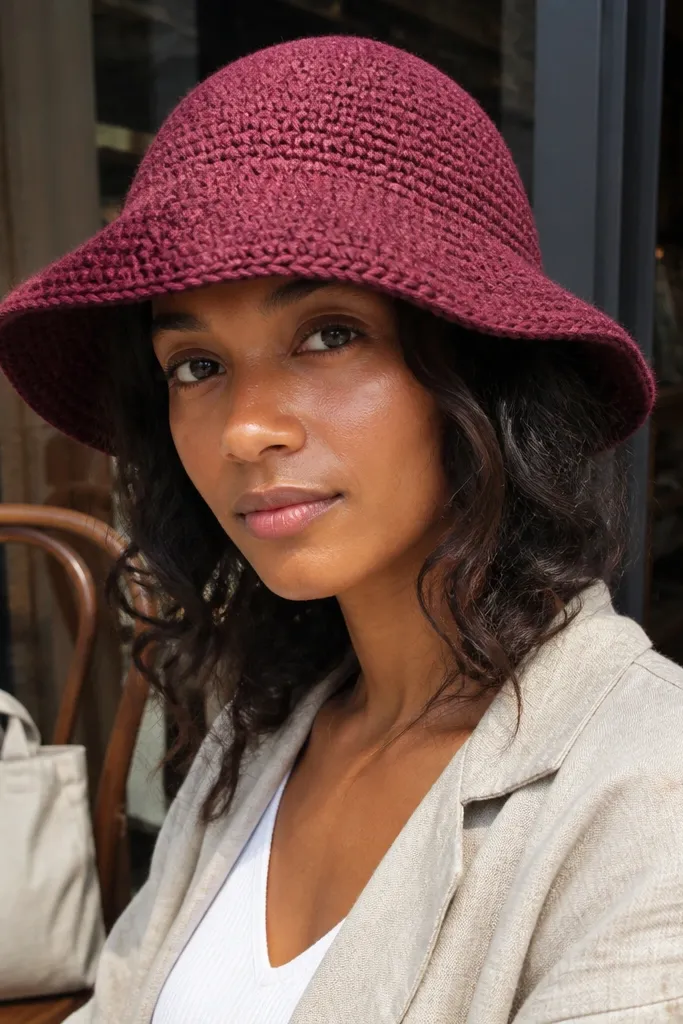 Berry-colored crochet bucket hat with a structured brim