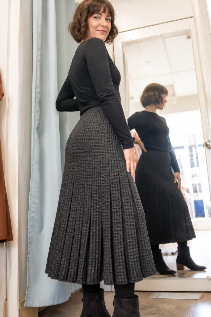 Skirt with waffle-texture panels that create a pleated look