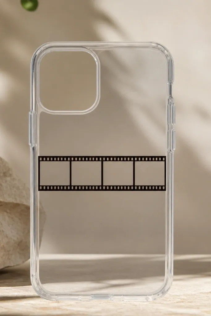 A clear case with a thin horizontal film strip graphic in the middle, framed by a clear resin rectangle, with small square perforation marks visible.