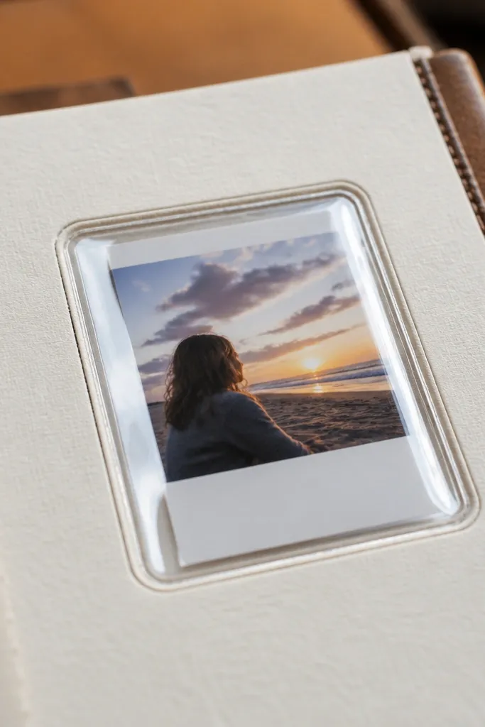 A cardstock card with a clear window showing a printed date and a small