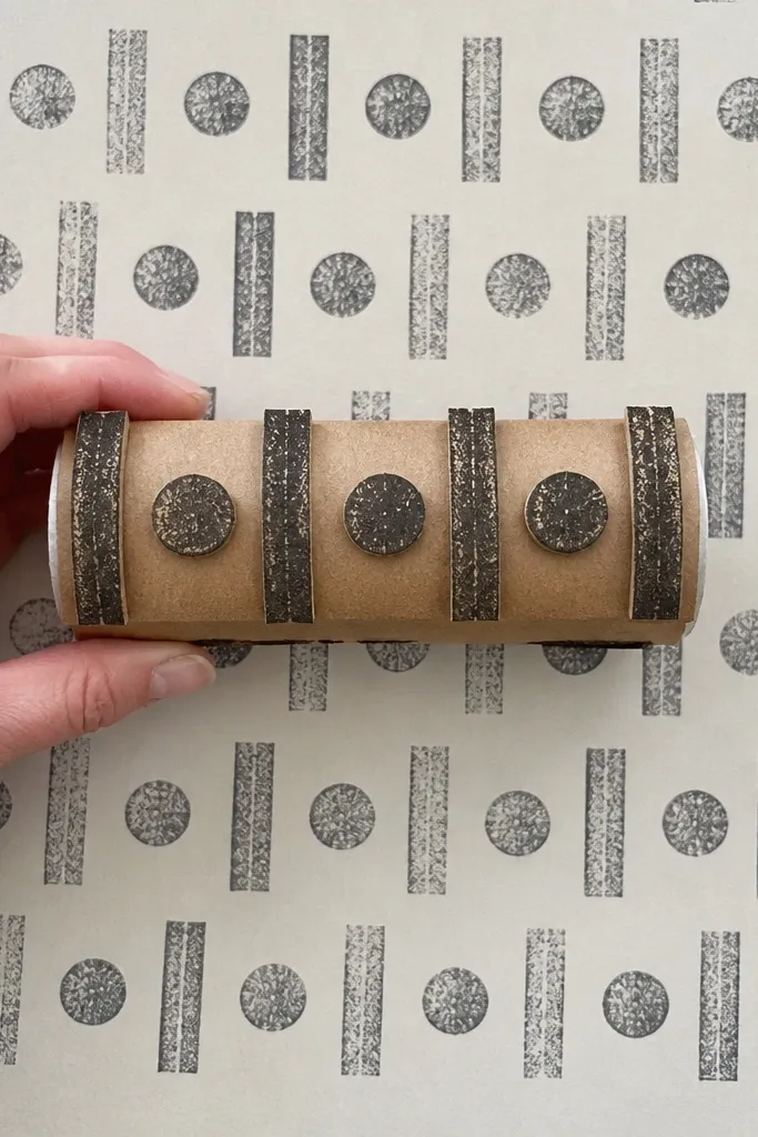 A repeated date stamp pattern made from cardboard on a page with one
