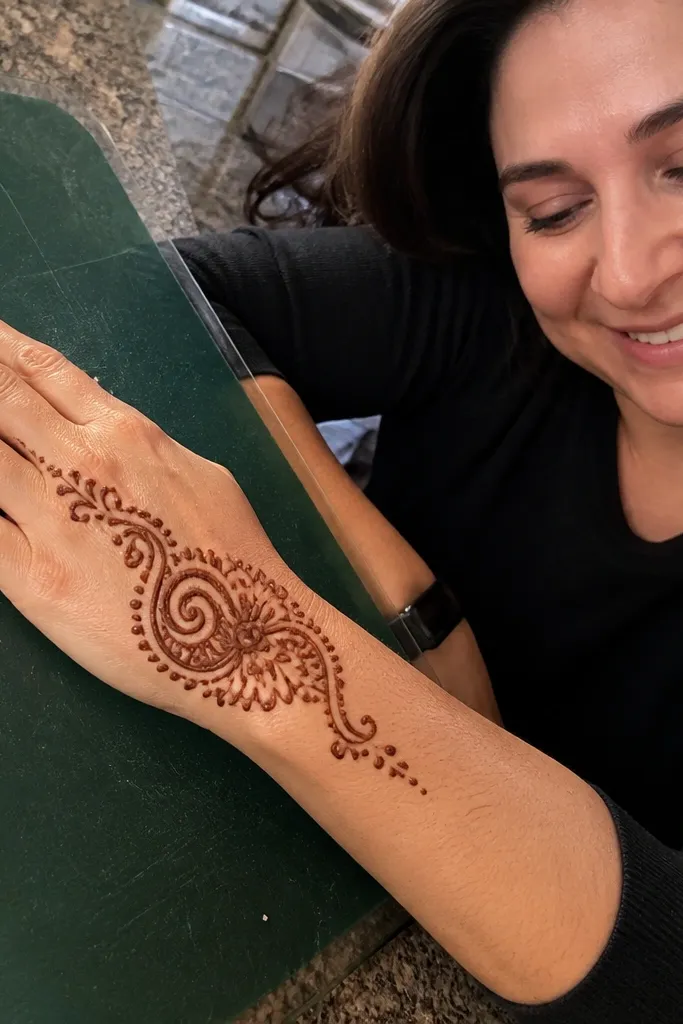 Single side swirl on back hand with tiny dots around it