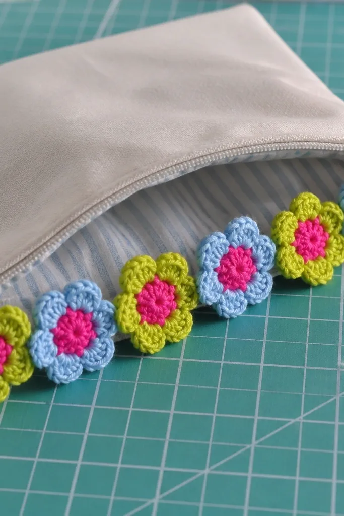 Six small crochet flower appliques in bright colors