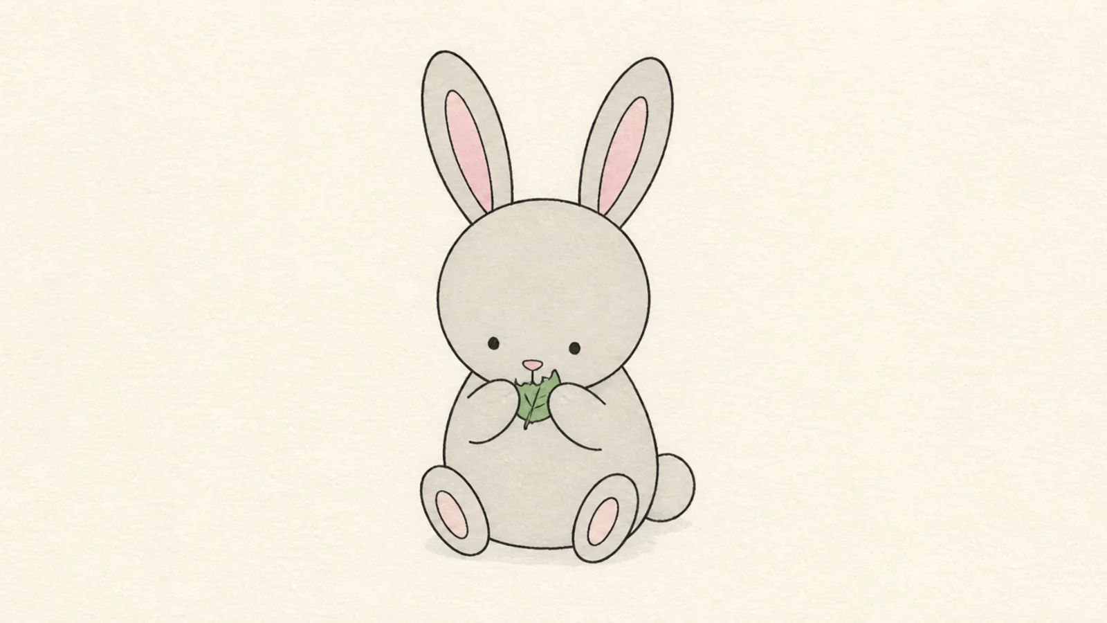 A simple rabbit nibbling a leaf held in its paws