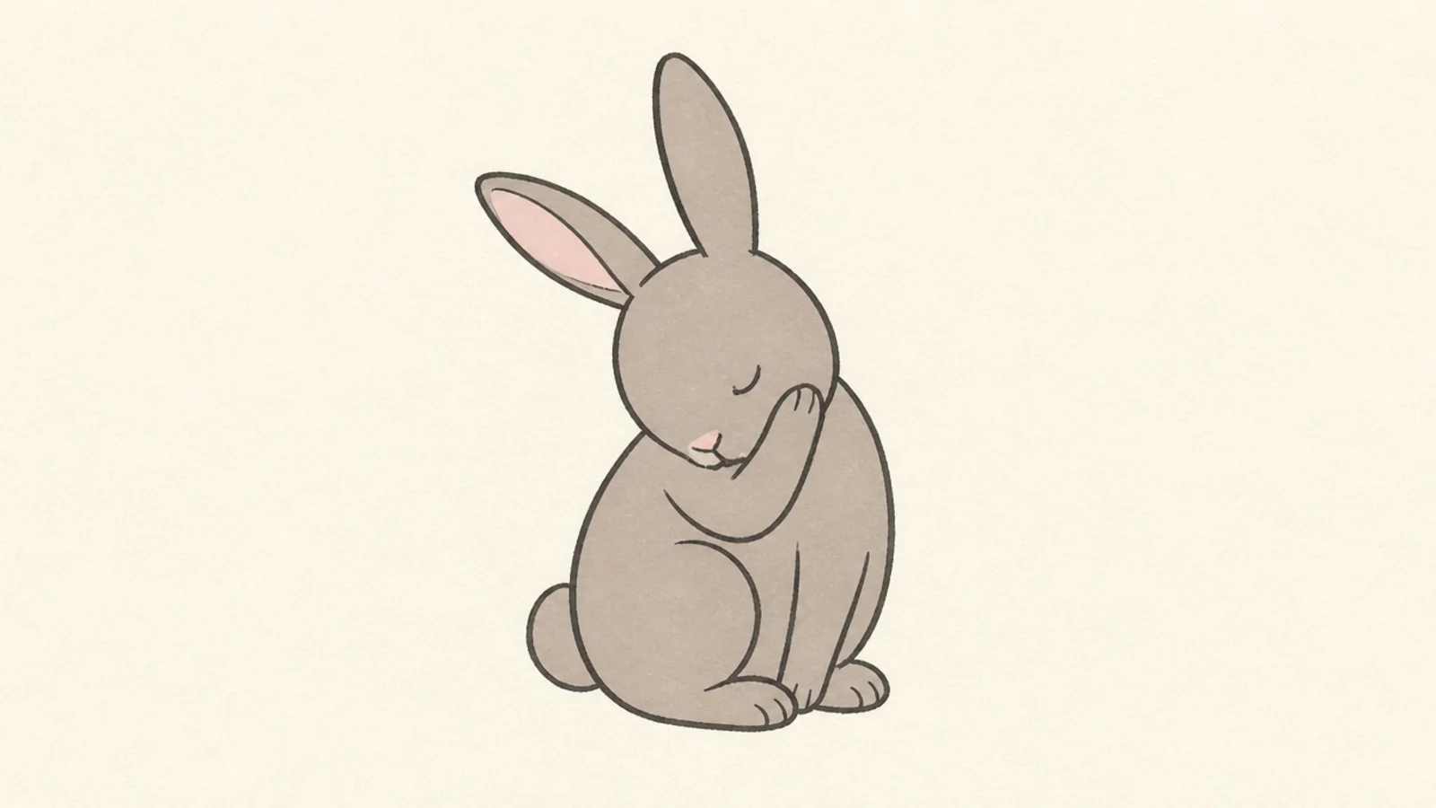 A simple rabbit grooming with a paw to its face