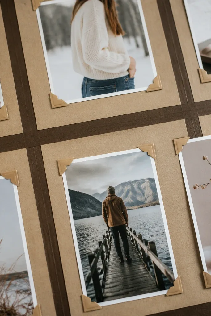 Kraft paper board with black tape grid and photos mounted on corners