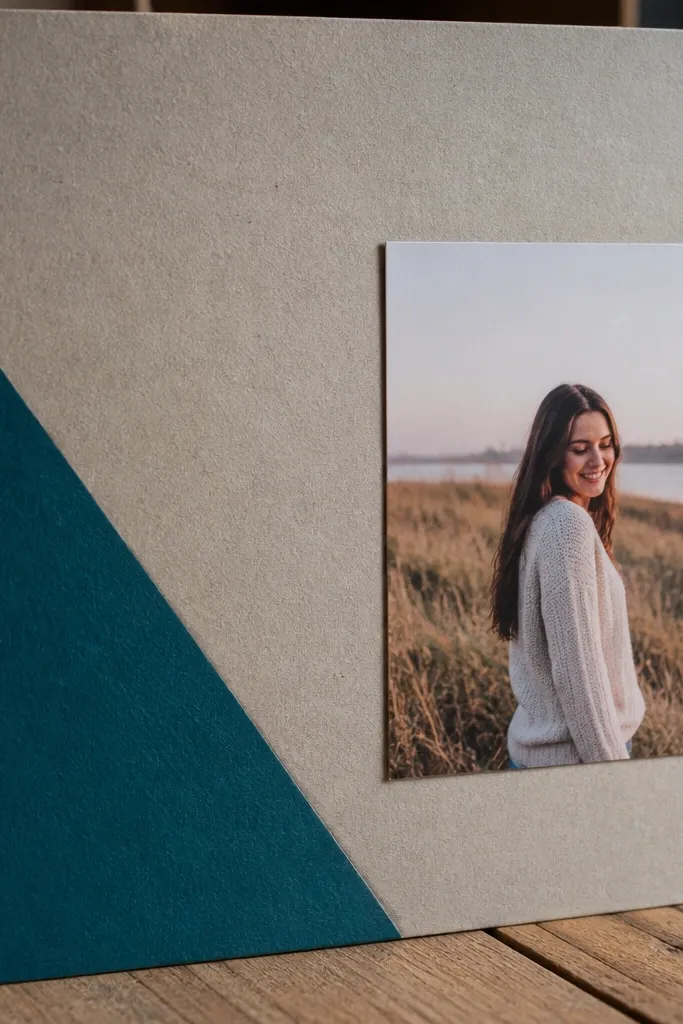 Light cardboard page with a painted triangle in one corner and a small centered