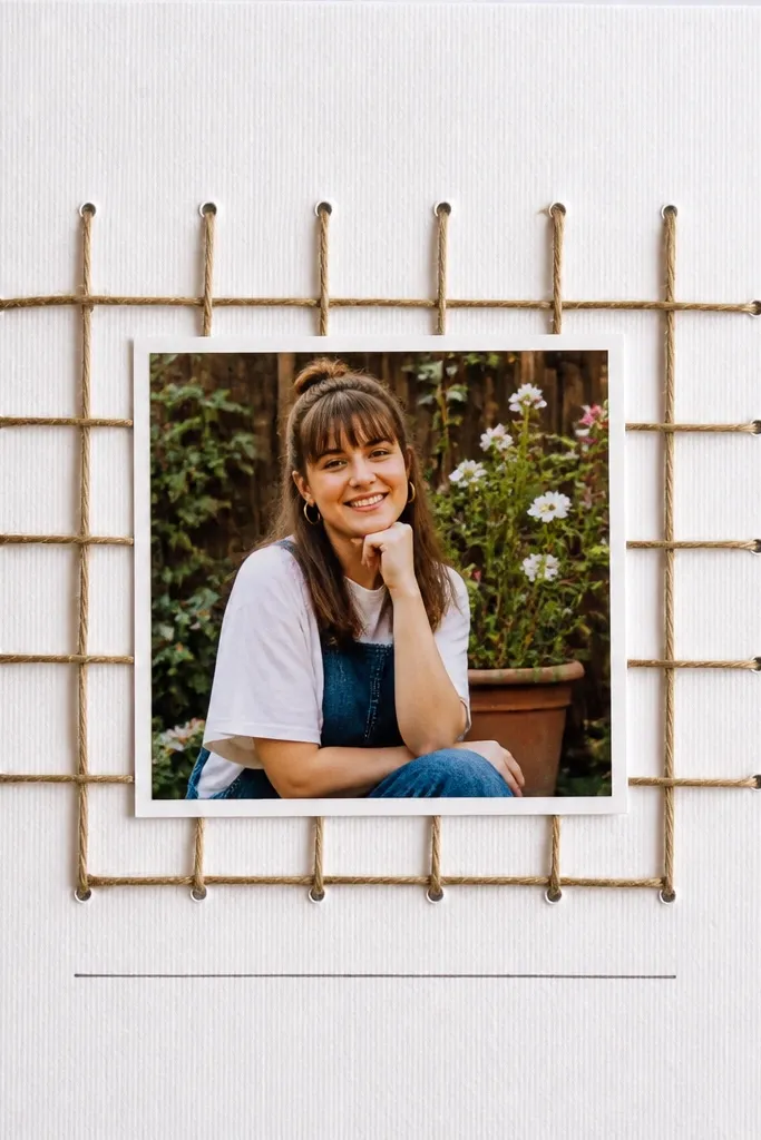 A tiny grid with twine lines across a page and a small centered