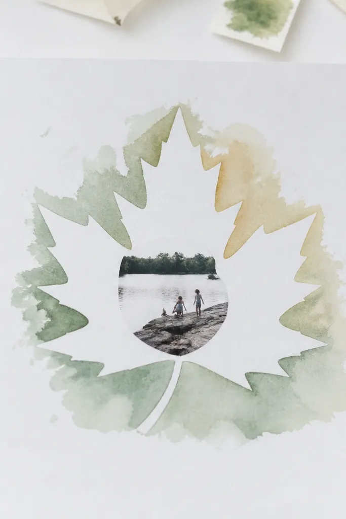 Leaf silhouettes made from paper under ink wash with a small centered