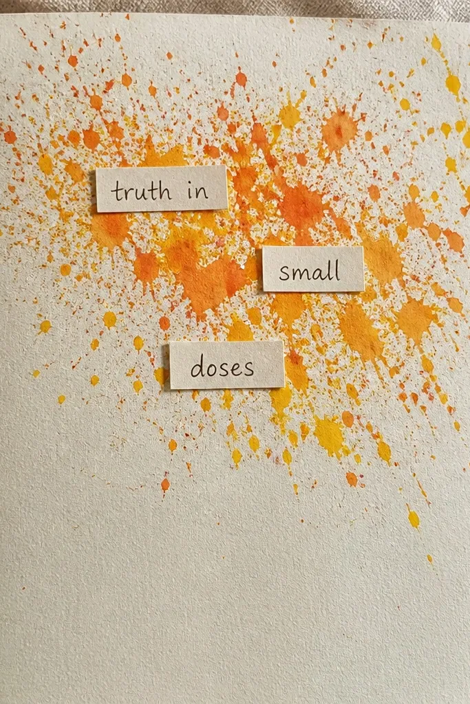 White page splattered with orange and yellow ink with small citrus labels