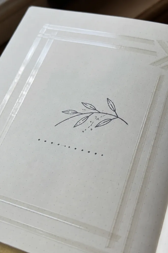 Transparent tape lines forming a geometric frame with handwritten text